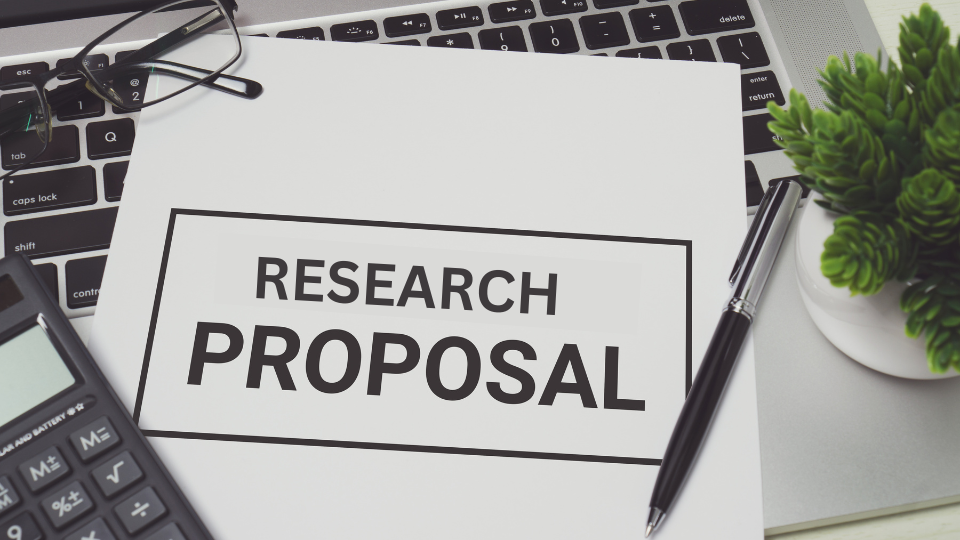 A research proposal lays the foundation for your study, while the research proposal defense tests your ability to justify and articulate that foundation to a committee.